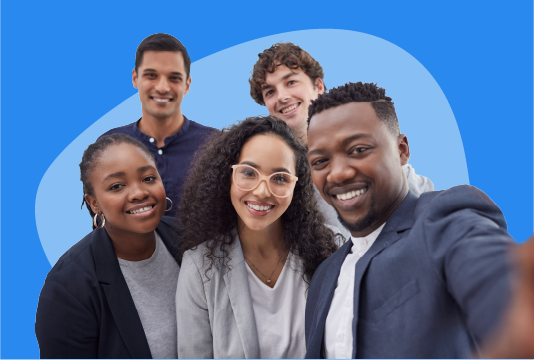Five young employees are smiling and looking toward the camera